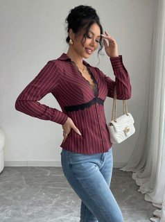 Angled front view of the burgundy striped lace-trim v-neck long-sleeve top, showing the silhouette and fit.