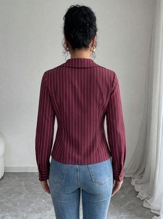 Back view of the burgundy striped lace-trim v-neck long-sleeve top, showing the silhouette and fit.