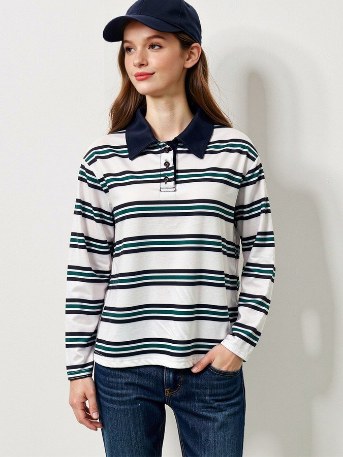 Angled front view of the white and navy striped long-sleeve polo shirt, showing its silhouette and design details.