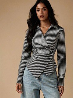 Styled front view of the black and white striped asymmetric wrap shirt, showing its silhouette and design details.
