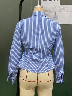 Mannequin view of the blue striped asymmetric wrap shirt, showing the garment shape and construction.
