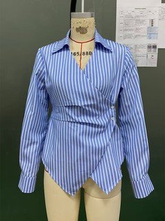 Mannequin view of the blue striped asymmetric wrap shirt, showing the garment shape and construction.