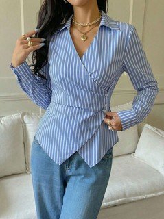 Studio front view of the blue striped asymmetric wrap shirt, showing its silhouette and design details.