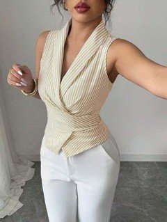 Lifestyle front view of the cream striped sleeveless wrap blouse, showing its silhouette and design details.