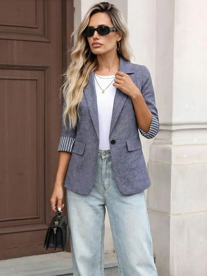 Front view of the gray striped three-quarter-sleeve single-button blazer, showing the silhouette and fit.