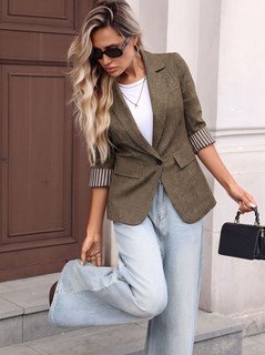 Seated front view of the brown striped three-quarter-sleeve single-button blazer, showing the silhouette and fit.