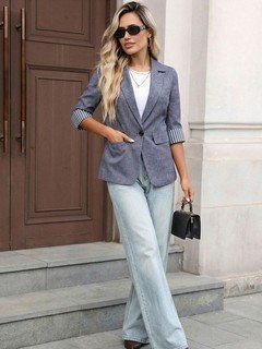 Angled front view of the gray striped three-quarter-sleeve single-button blazer, showing the silhouette and fit.