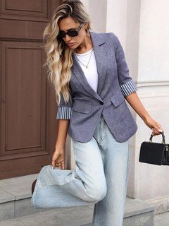 Side view of the gray striped three-quarter-sleeve single-button blazer, showing the silhouette and fit.