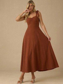 Full-length front view of the rust sweetheart tie-strap midi dress, showing its silhouette and design details.