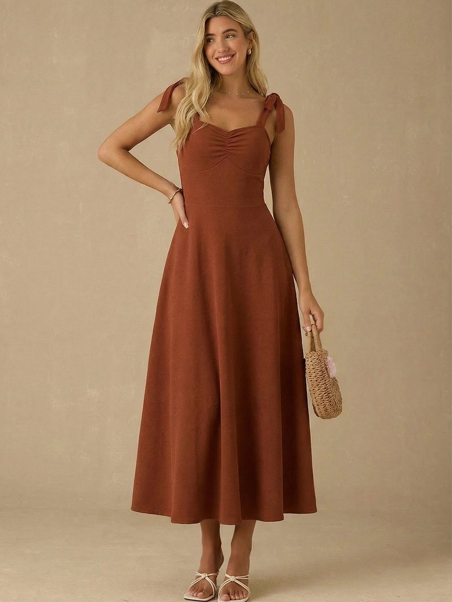 Rust Sweetheart Tie-Strap Midi Dress – Front View Front view of the rust sweetheart tie-strap midi dress, showing its silhouette and design details.