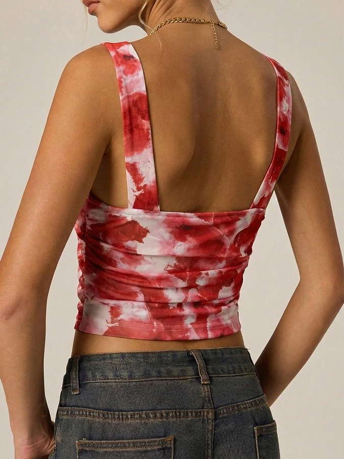 Back view of the red and white tie-dye v-neck cropped tank top, showing its silhouette and design details.