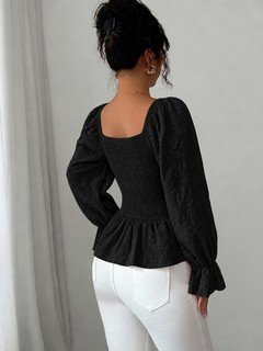 Back view of the black tie-neck corset peplum blouse, showing its silhouette and design details.