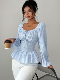 Styled front view of the light blue tie-neck corset peplum blouse, showing its silhouette and design details.