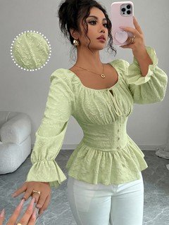 Front view of the light green tie-neck corset peplum blouse, showing its silhouette and design details.