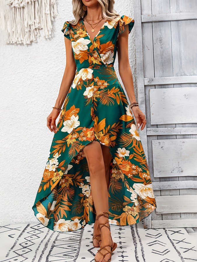 Front view of the green tropical floral high-low dress, showing its silhouette and design details.