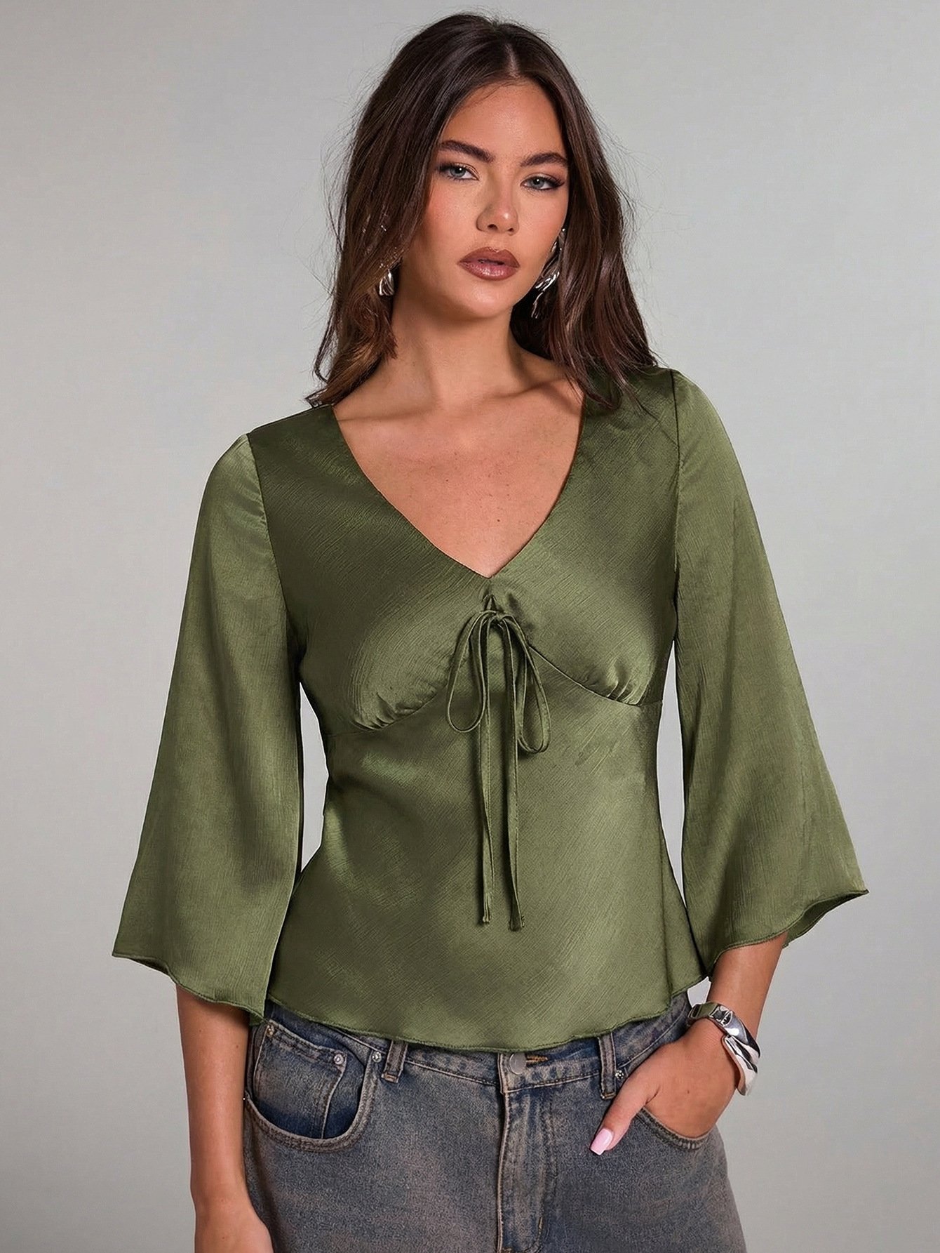 Olive Green Ruched Tie-Front Bell-Sleeve Top – Front View Front view of the olive green ruched tie-front bell-sleeve top, showing its silhouette and design details.