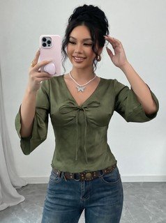 Angled front view of the olive v-neck bell-sleeve tie-waist blouse, showing the silhouette and fit.