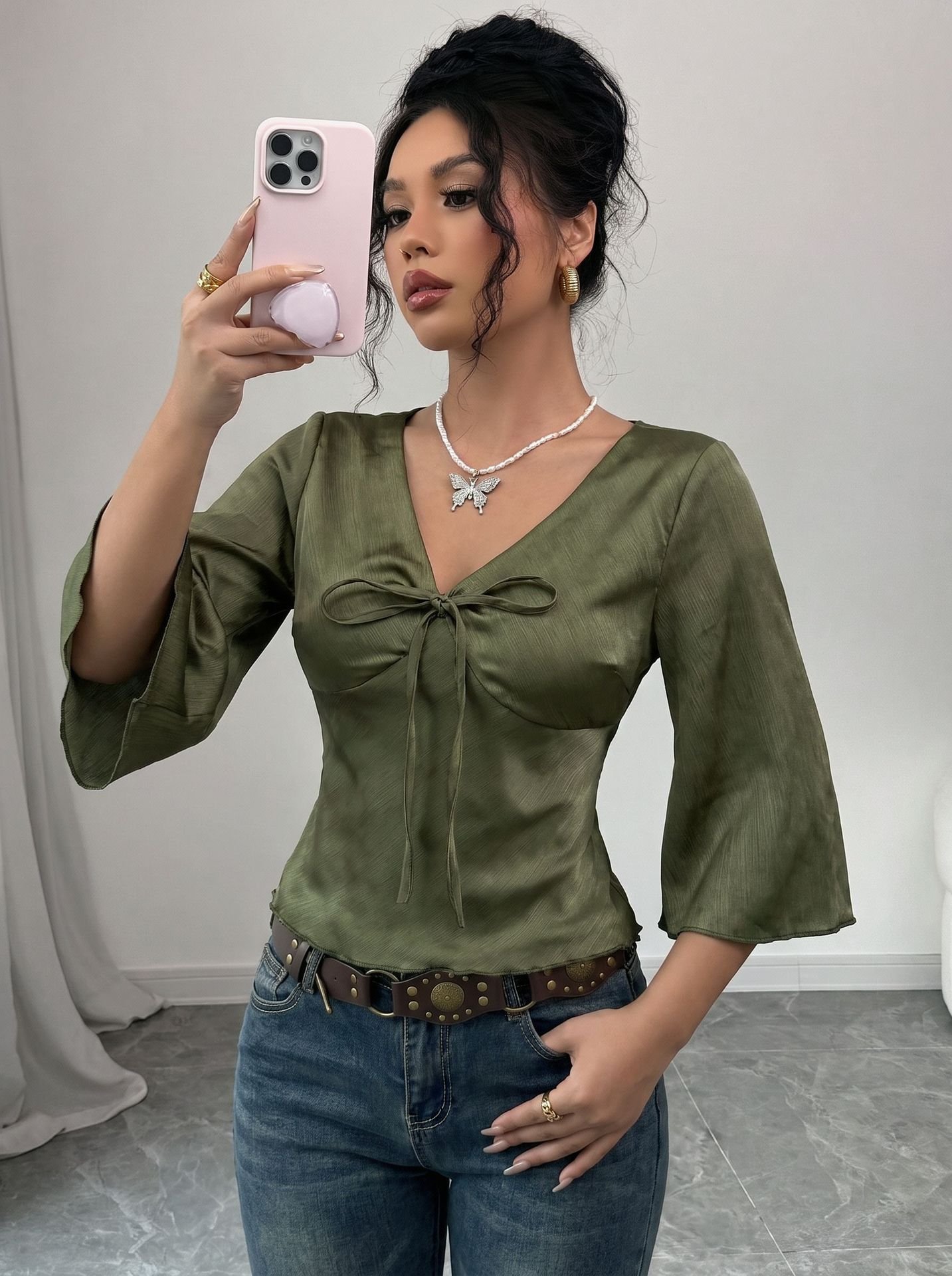Olive V-Neck Bell-Sleeve Tie-Waist Blouse – Front View Front view of the olive v-neck bell-sleeve tie-waist blouse, showing the silhouette and fit.