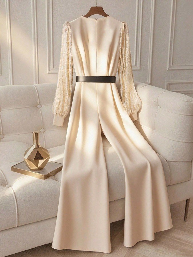Alternate garment view of the ivory v-neck belted long-sleeve wide-leg jumpsuit, showing the silhouette and fit.