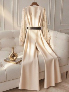Alternate garment view of the ivory v-neck belted long-sleeve wide-leg jumpsuit, showing the silhouette and fit.
