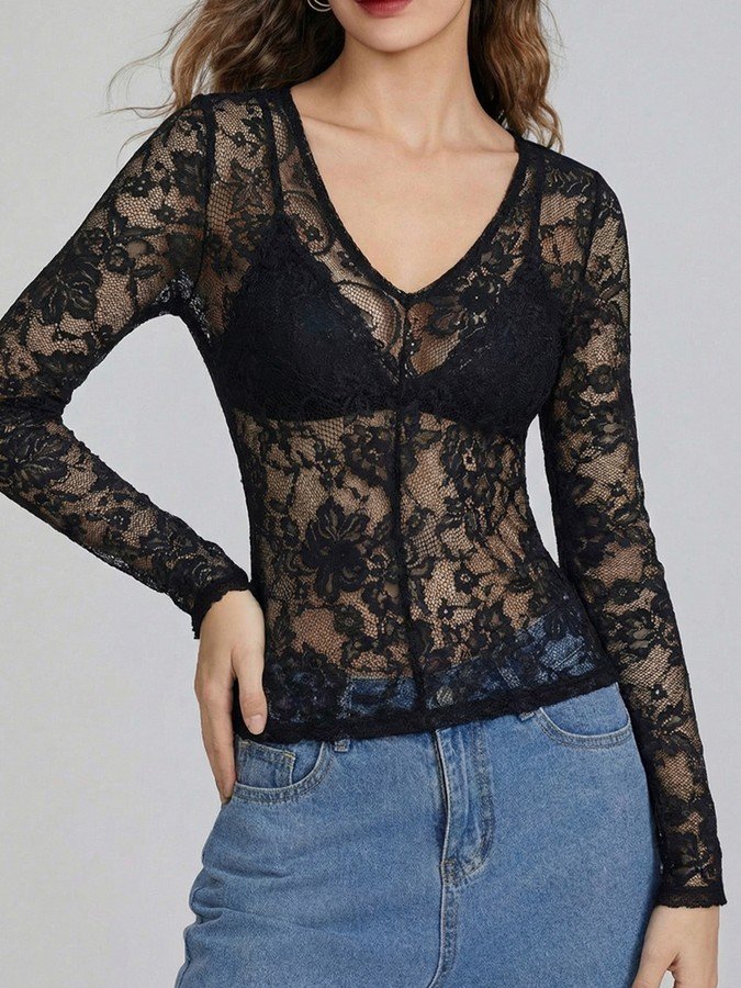 Front view of the black v-neck sheer floral lace top, showing its silhouette and design details.