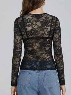 Back view of the black v-neck sheer floral lace top, showing its silhouette and design details.