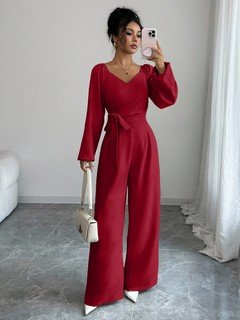 Front view of the red v-neck tie-waist long-sleeve wide-leg jumpsuit, showing the silhouette and fit.