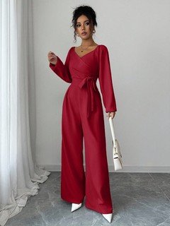 Side view of the red v-neck tie-waist long-sleeve wide-leg jumpsuit, showing the silhouette and fit.