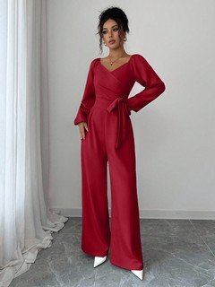 Styled front view of the red v-neck tie-waist long-sleeve wide-leg jumpsuit, showing the silhouette and fit.