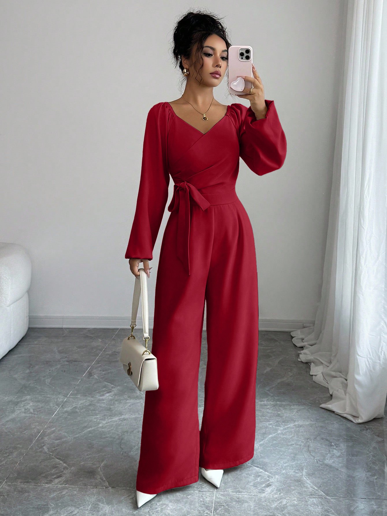 Red V-Neck Tie-Waist Long-Sleeve Wide-Leg Jumpsuit – Front View Front view of the red v-neck tie-waist long-sleeve wide-leg jumpsuit, showing the silhouette and fit.
