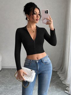 Front view of the black zip-front deep-v long-sleeve cropped top, showing the silhouette and fit.