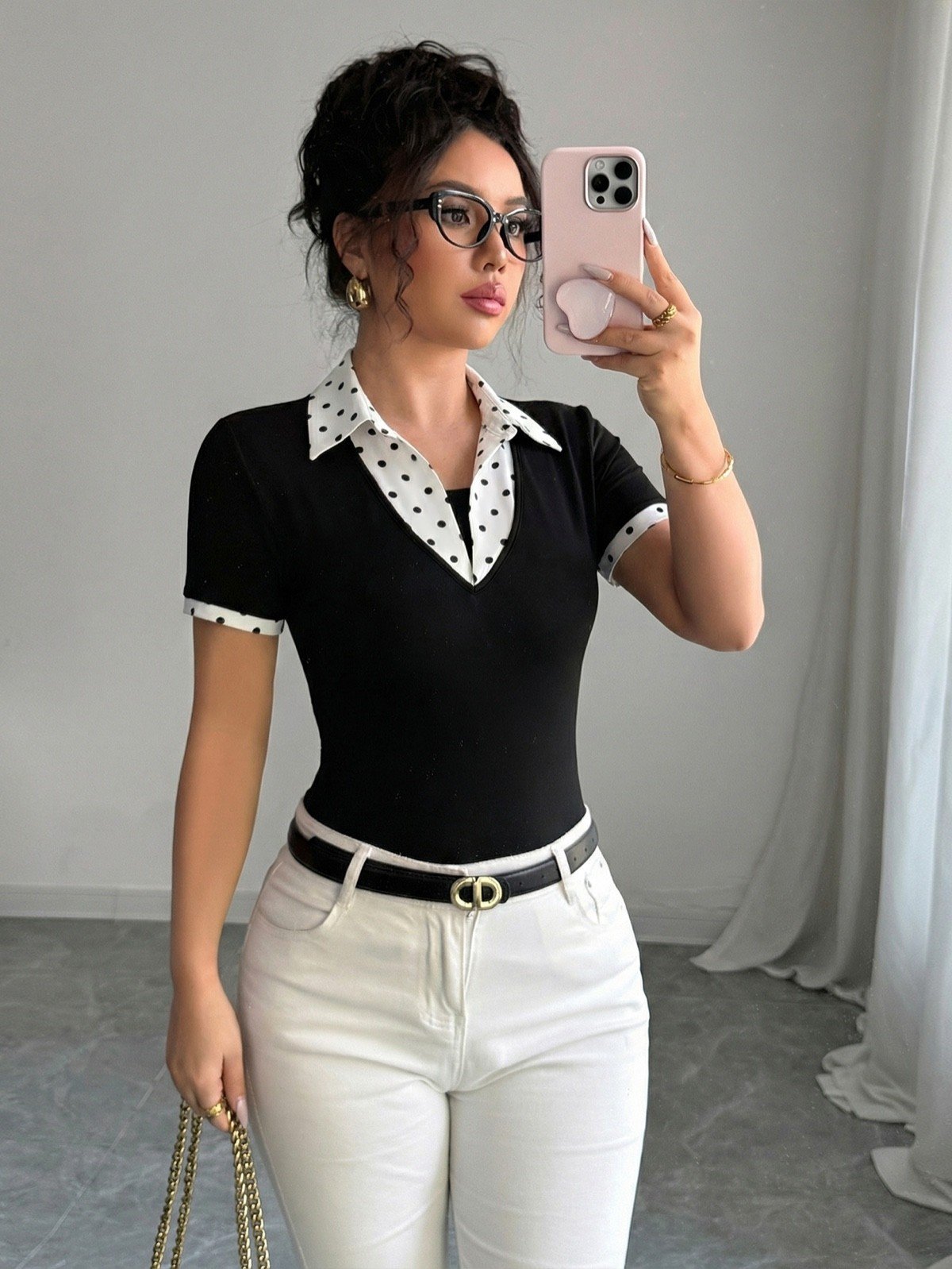 Polka-Dot Contrast-Collar Polo Top – Mirror Front View Mirror front view of a black fitted polo top with a white polka-dot collar and cuffs.