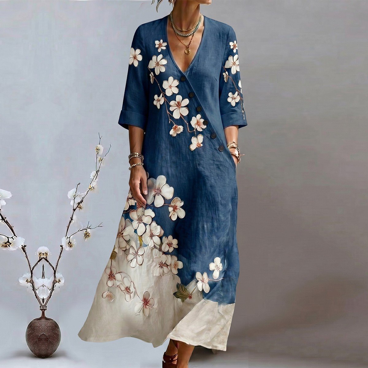 Primary front view of a blue floral print V-neck maxi dress with three-quarter sleeves.