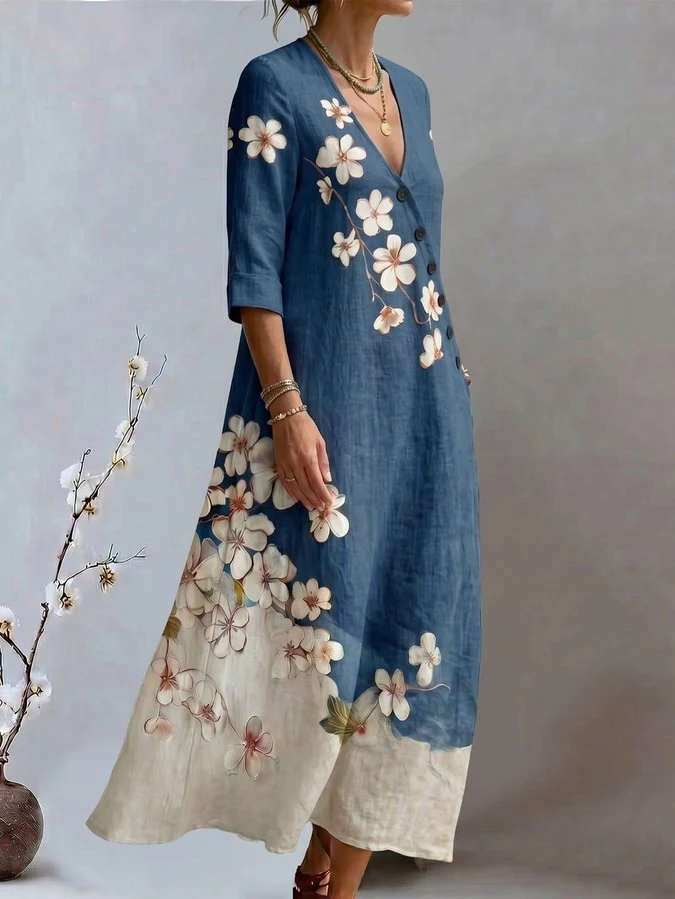 Front view of a blue floral print V-neck maxi dress with three-quarter sleeves.
