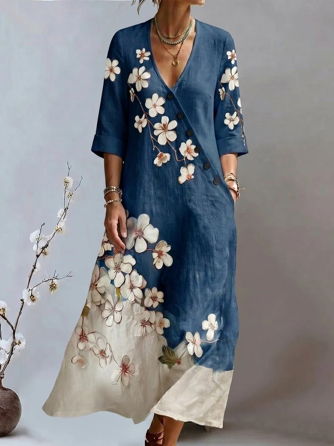 Relaxed front view of a blue floral print V-neck maxi dress with three-quarter sleeves.