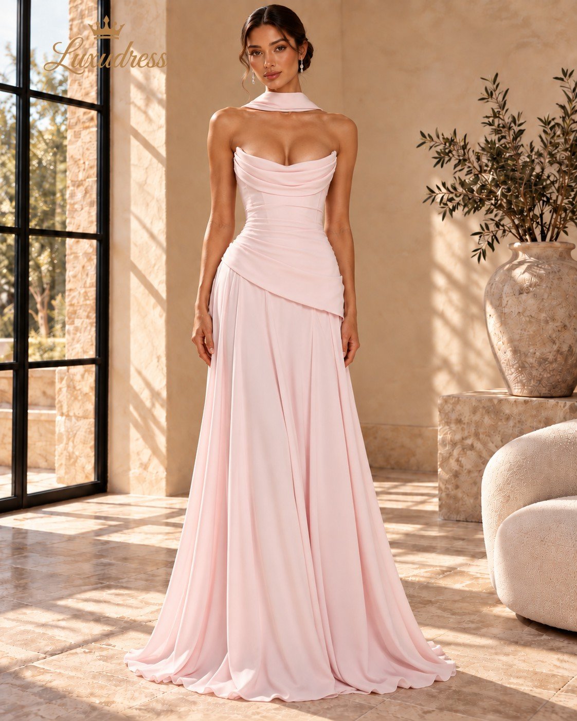 Blush Pink Cowl Neck Evening Gown Front View Front view of a blush pink strapless cowl neck evening gown with a fitted bodice, asymmetric draped waist and flowing skirt.