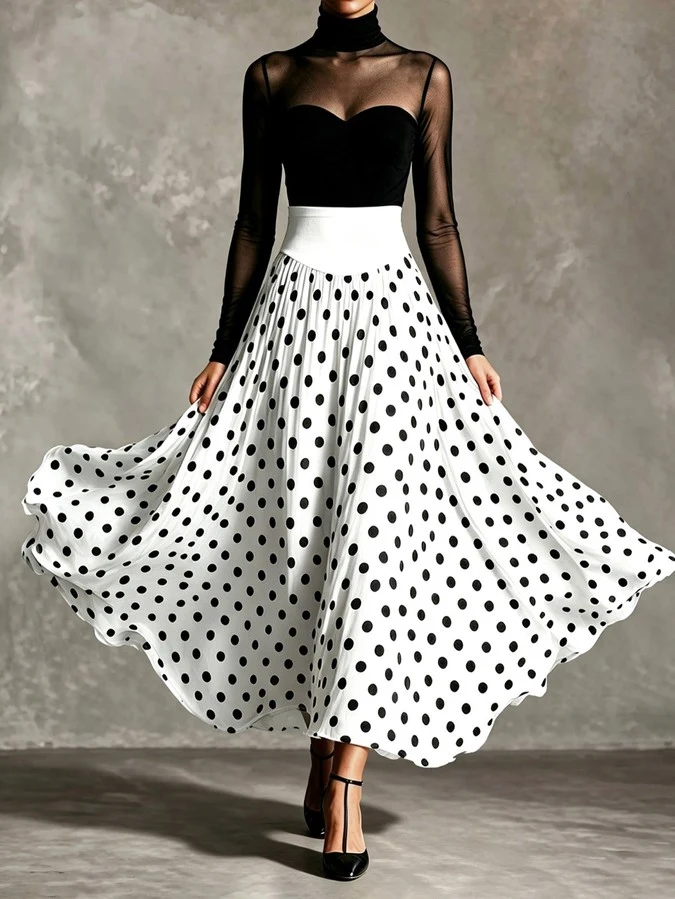 Skirt sweep detail of a black sheer mesh top and white polka-dot full-circle maxi skirt set.
