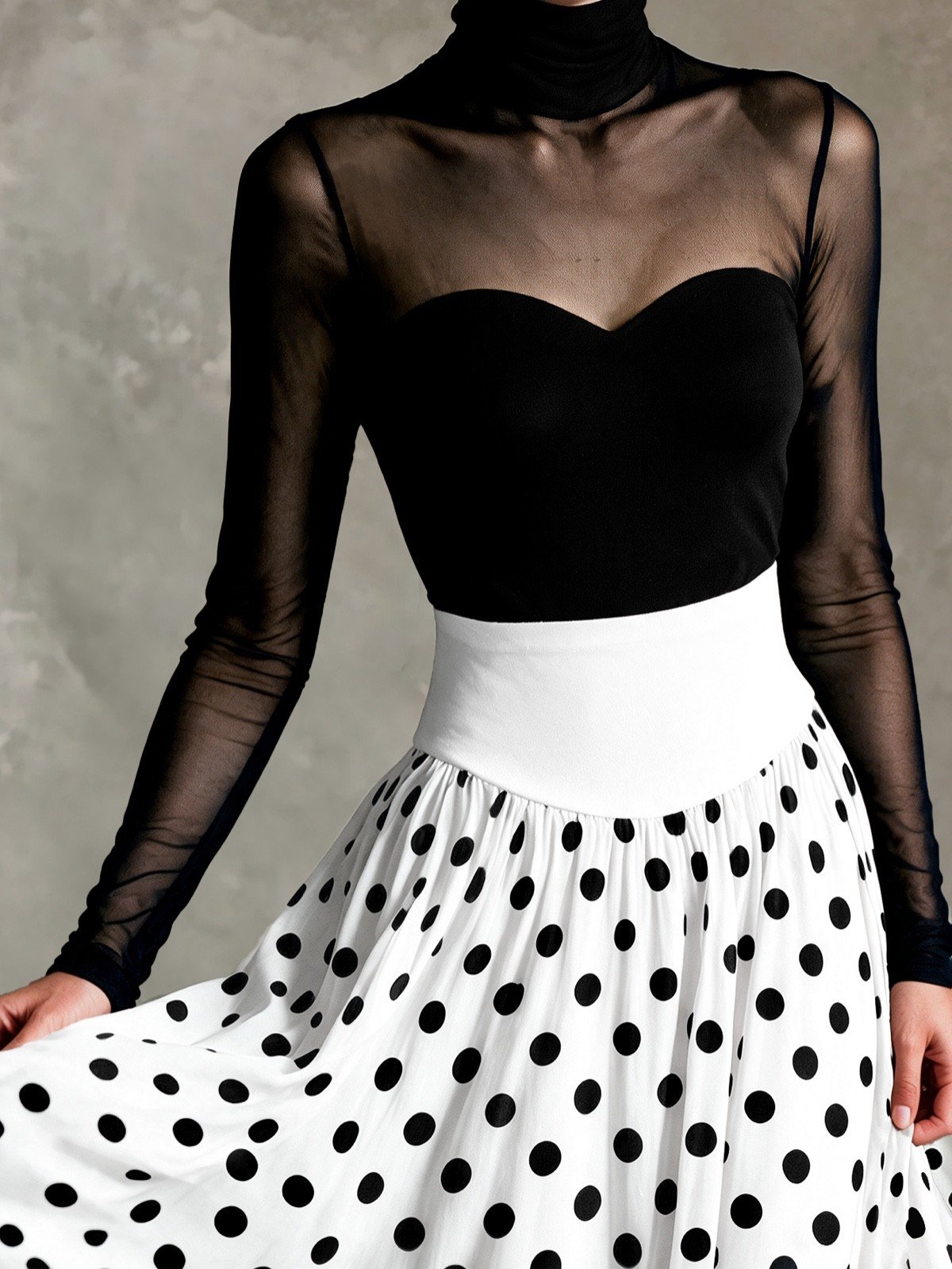 Mesh bodice close-up of a black sheer mesh top and white polka-dot full-circle maxi skirt set.