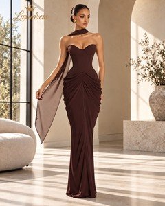 Front view of a chocolate brown strapless corset evening gown with shaped bust cups, fitted waist and ruched hip draping.