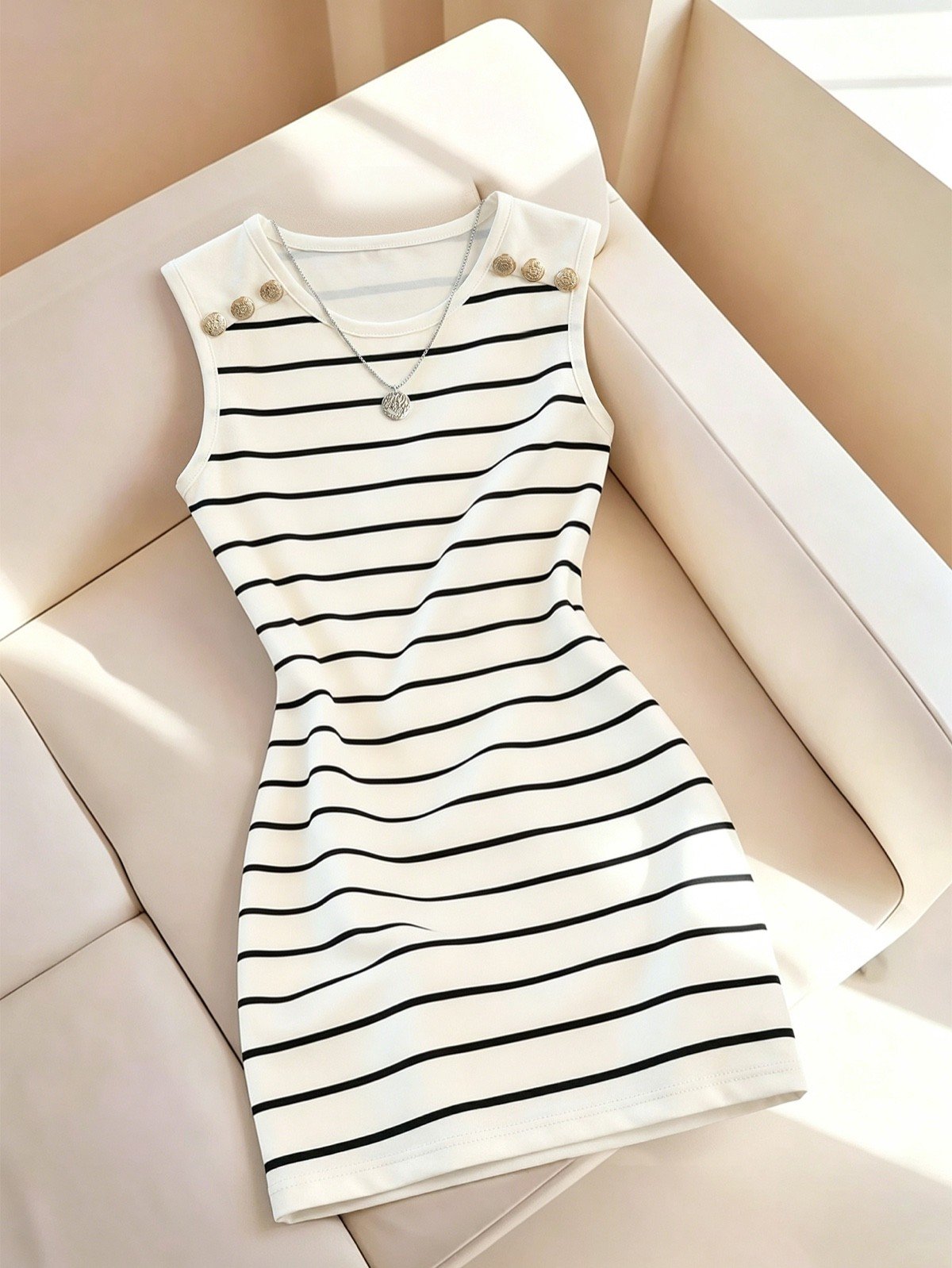 Striped Knit Bodycon Mini Dress – Front Flat-Lay Front flat-lay of a white striped knit bodycon mini dress with gold-tone shoulder buttons.