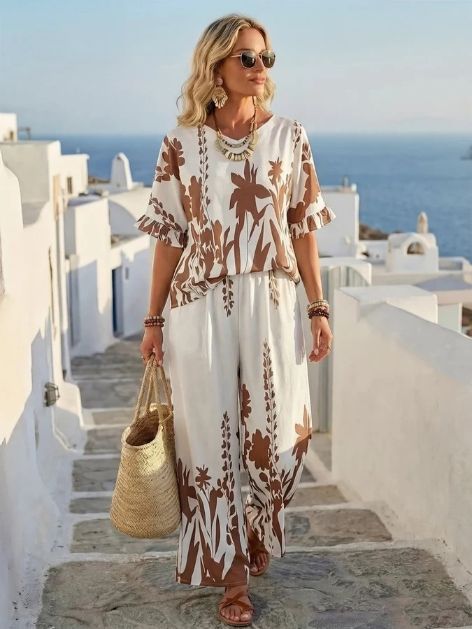 Primary front view of a tropical print short-sleeve top and wide-leg pants set.