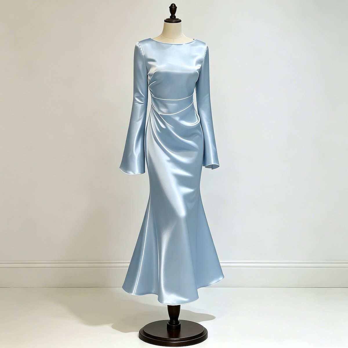 Dusty blue satin mermaid maxi dress with long bell sleeves, a round neckline and ruched waist